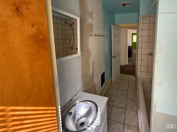 an empty room with a empty space and windows