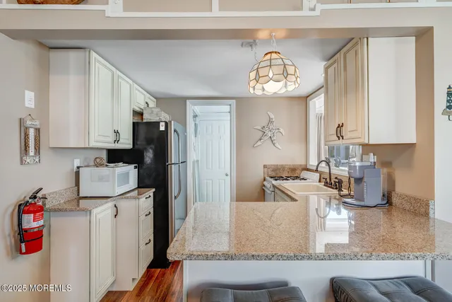 a view of a kitchen with furniture and a kitchen