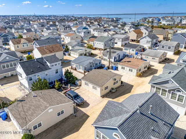an aerial view of a house with a lot of residential houses