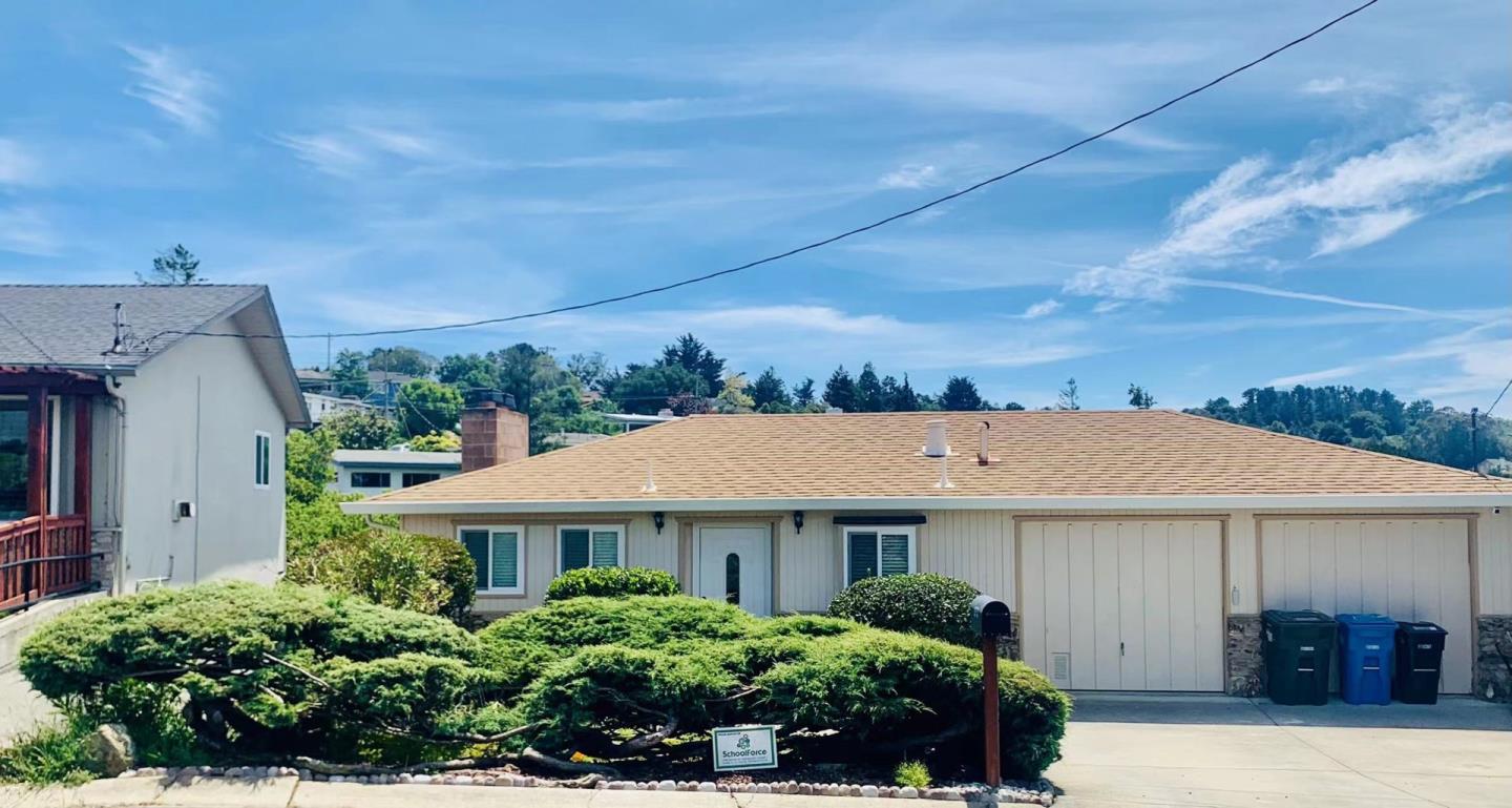 a aerial view of a house with a yard