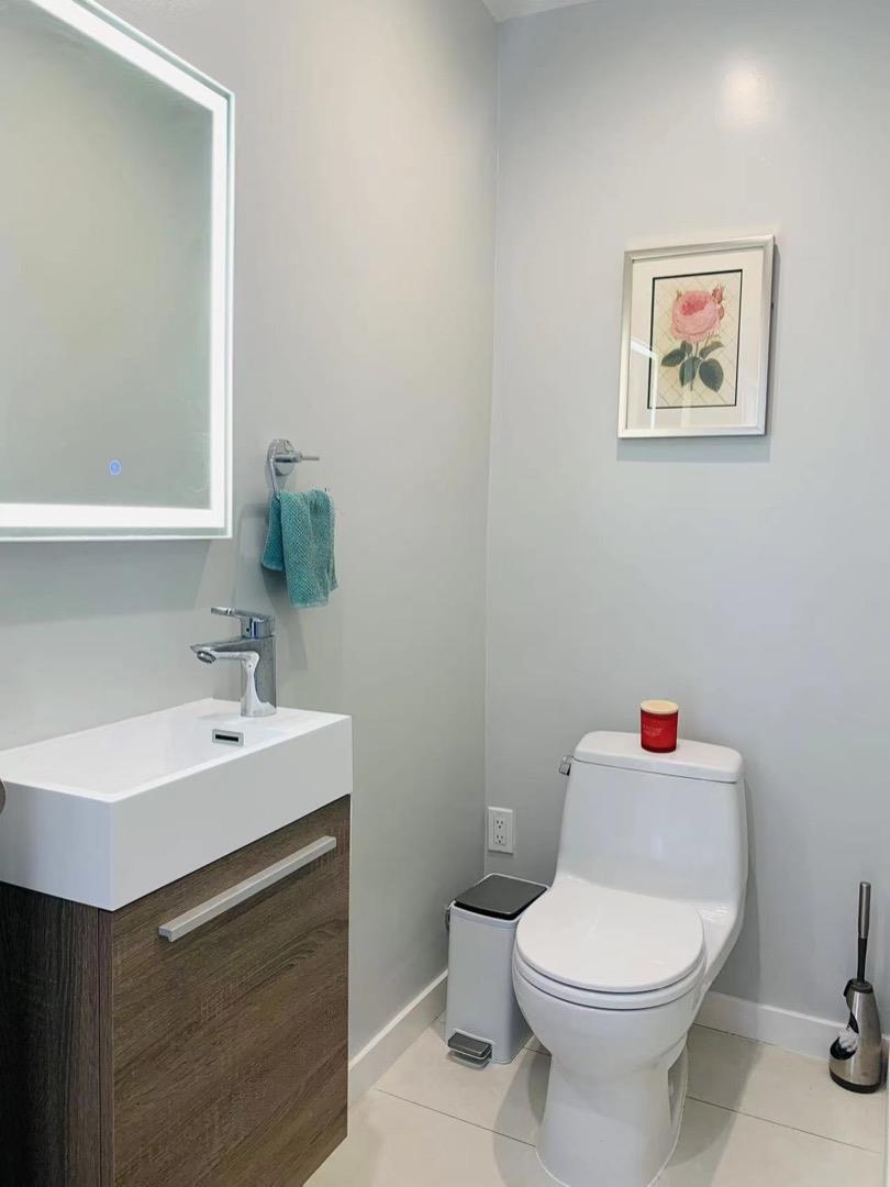 3513 Hillcrest Drive Belmont, CA 94002 - Photo 14 of 18 a bathroom with a sink mirror vanity and toilet