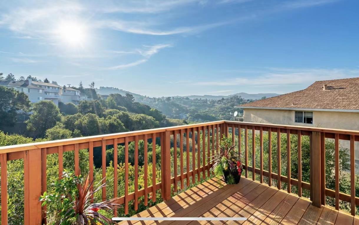 3513 Hillcrest Drive Belmont, CA 94002 - Photo 17 of 18 a balcony with wooden floor and city view