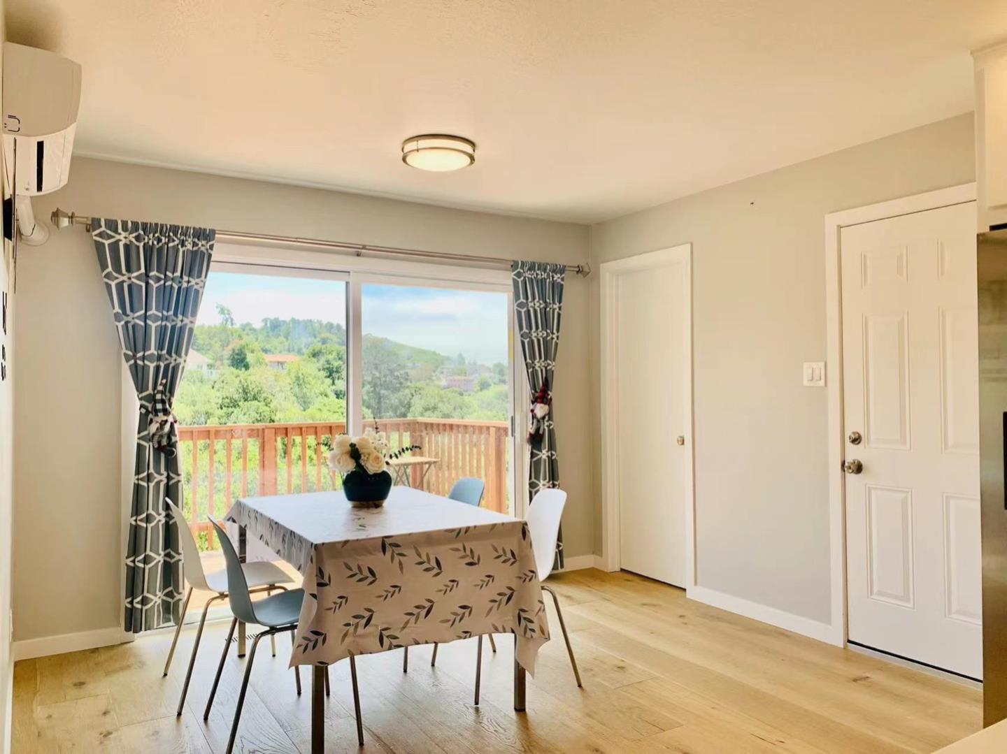 3513 Hillcrest Drive Belmont, CA 94002 - Photo 3 of 18 a dining room with furniture and wooden floor