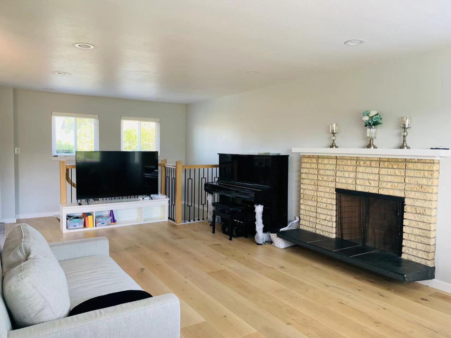 3513 Hillcrest Drive Belmont, CA 94002 - Photo 4 of 18 a living room with furniture and a flat screen tv