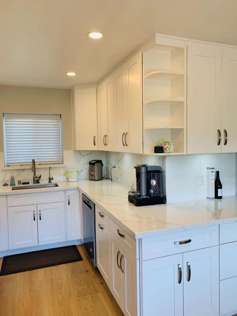 3513 Hillcrest Drive Belmont, CA 94002 - Photo 6 of 18 a kitchen with a white cabinets and sink