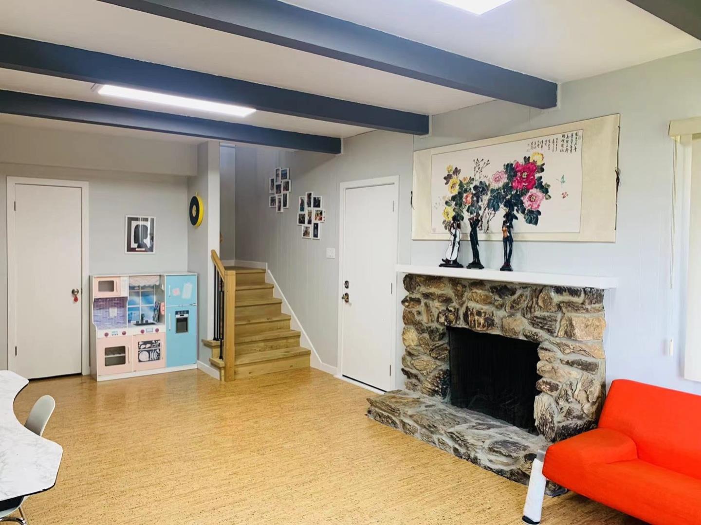 3513 Hillcrest Drive Belmont, CA 94002 - Photo 7 of 18 a living room with furniture and a fireplace