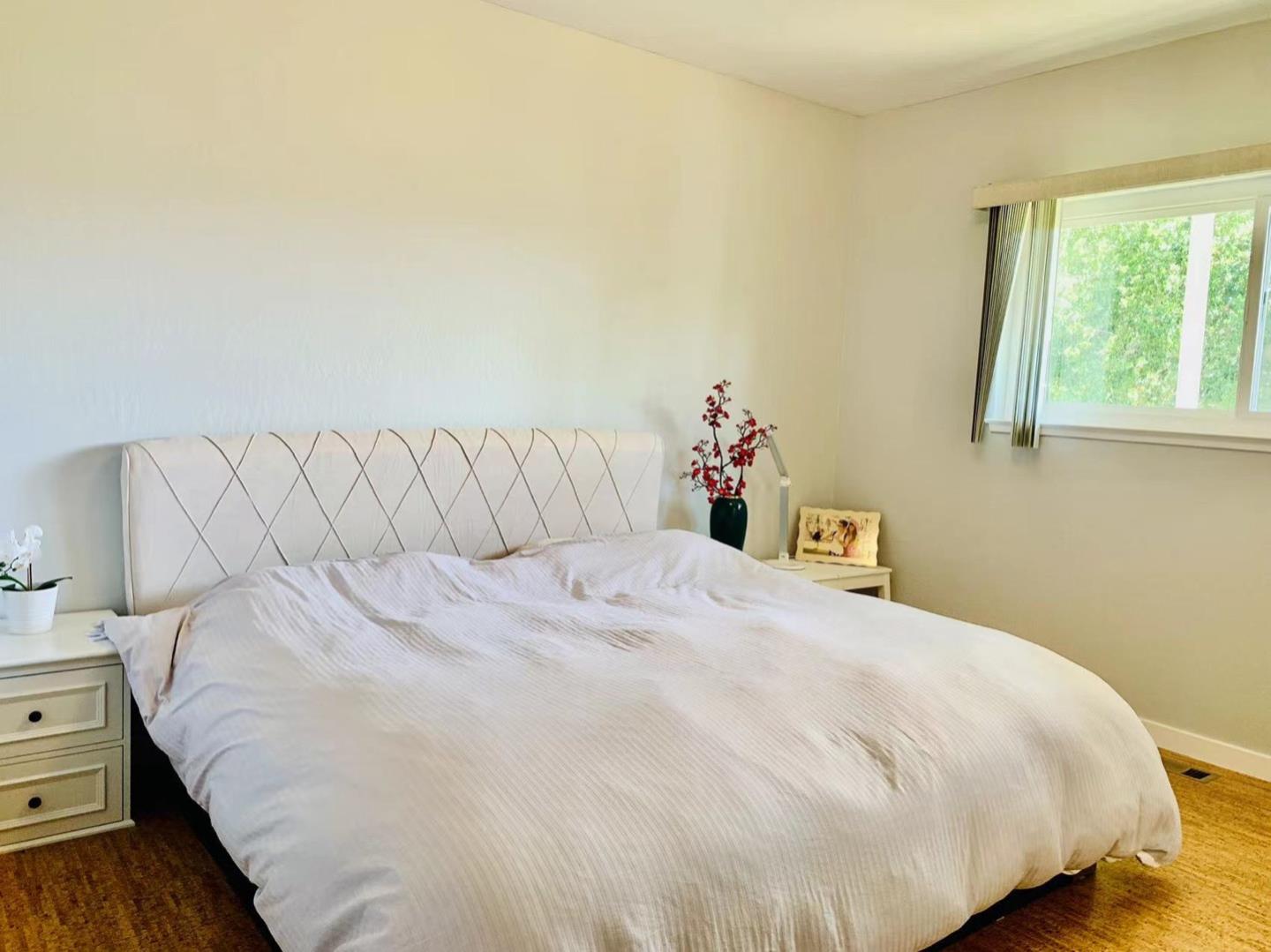 3513 Hillcrest Drive Belmont, CA 94002 - Photo 8 of 18 a bedroom with a bed and a window