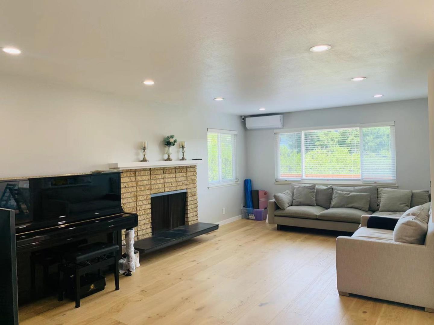 3513 Hillcrest Drive Belmont, CA 94002 - Photo 9 of 18 a living room with furniture and a fireplace