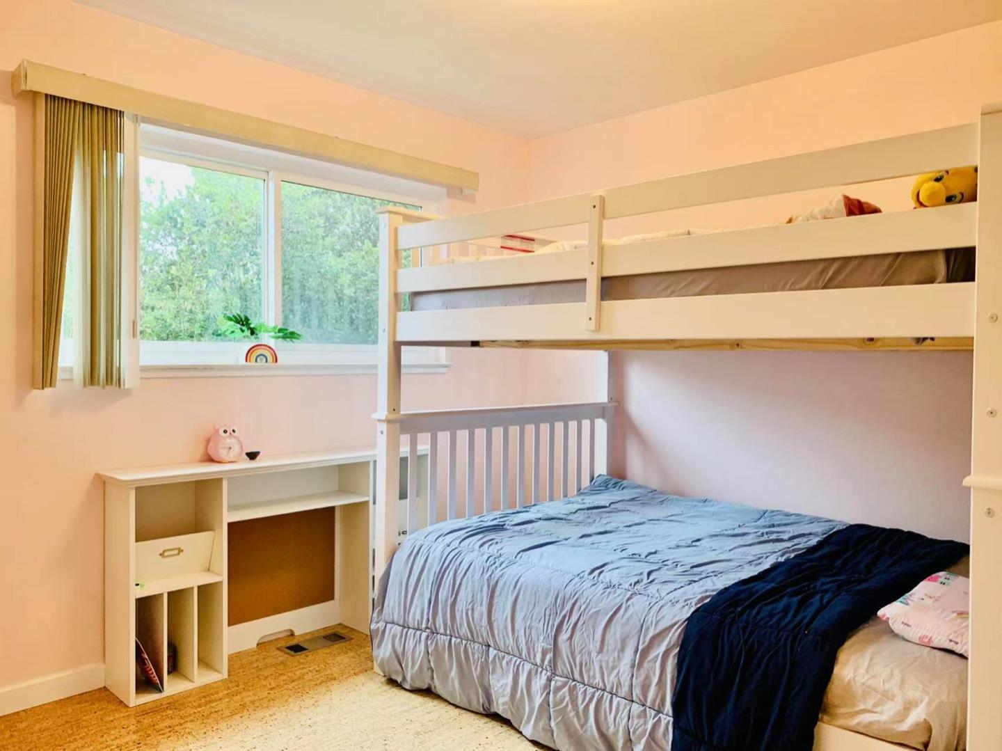 3513 Hillcrest Drive Belmont, CA 94002 - Photo 10 of 18 a bedroom with a bed and a window