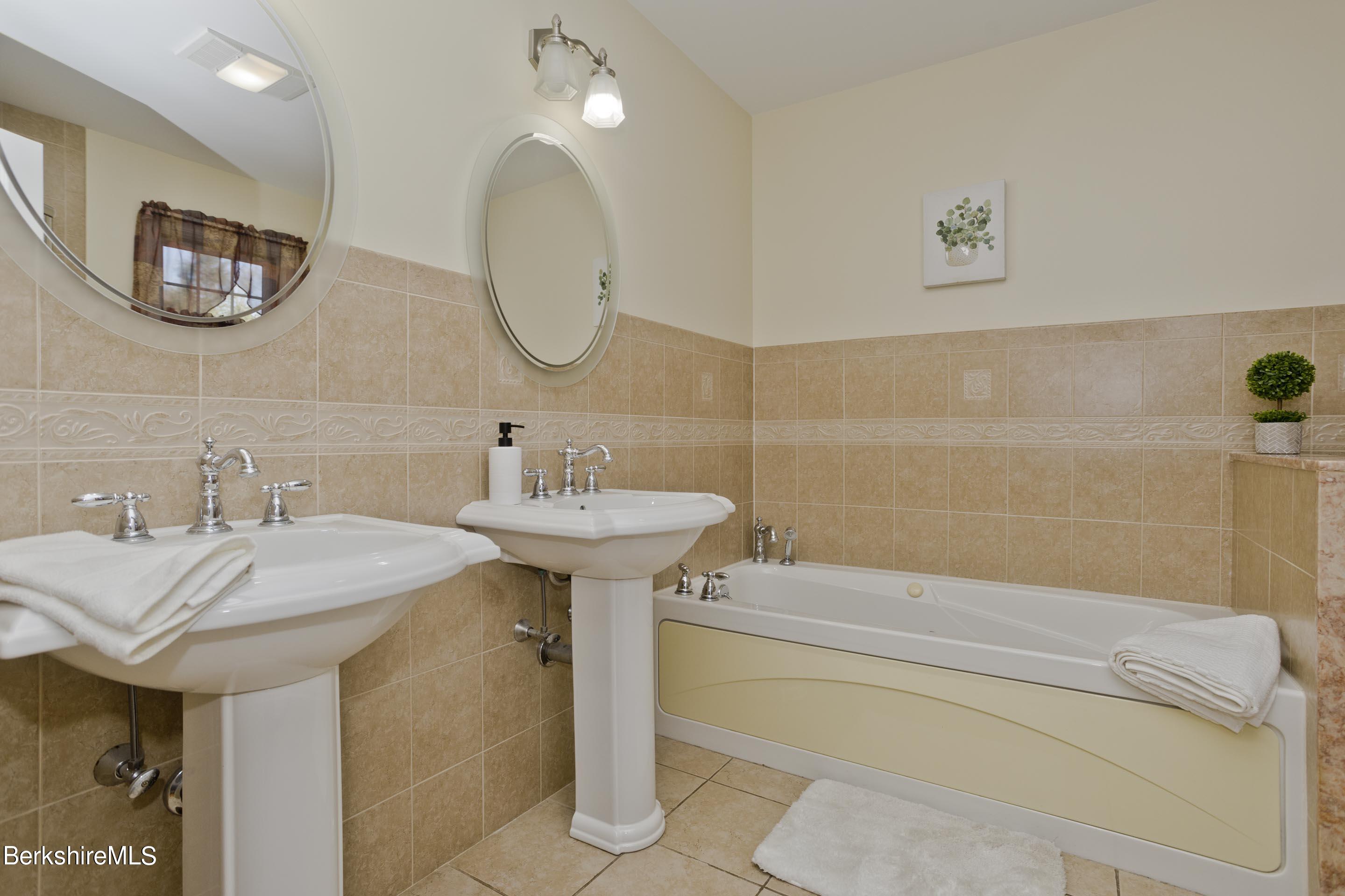 495 West Center Road Otis, MA 01253 - Photo 24 of 46 a bathroom with a sink and a mirror