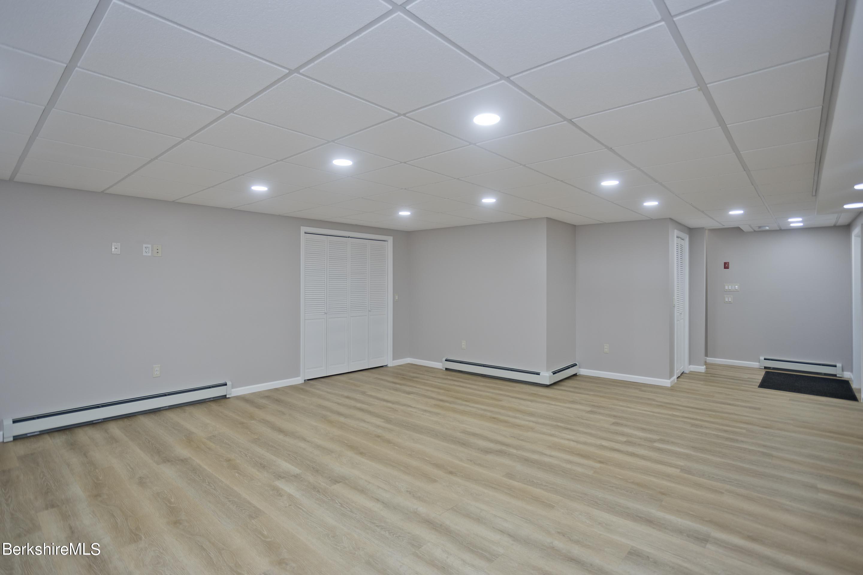 495 West Center Road Otis, MA 01253 - Photo 33 of 46 a view of an empty room with wooden floor