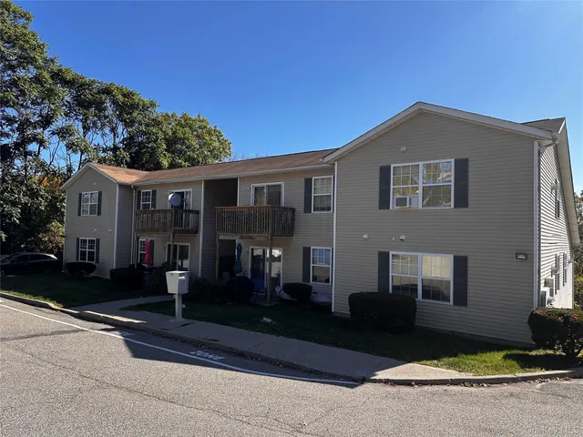 a front view of a house with yard