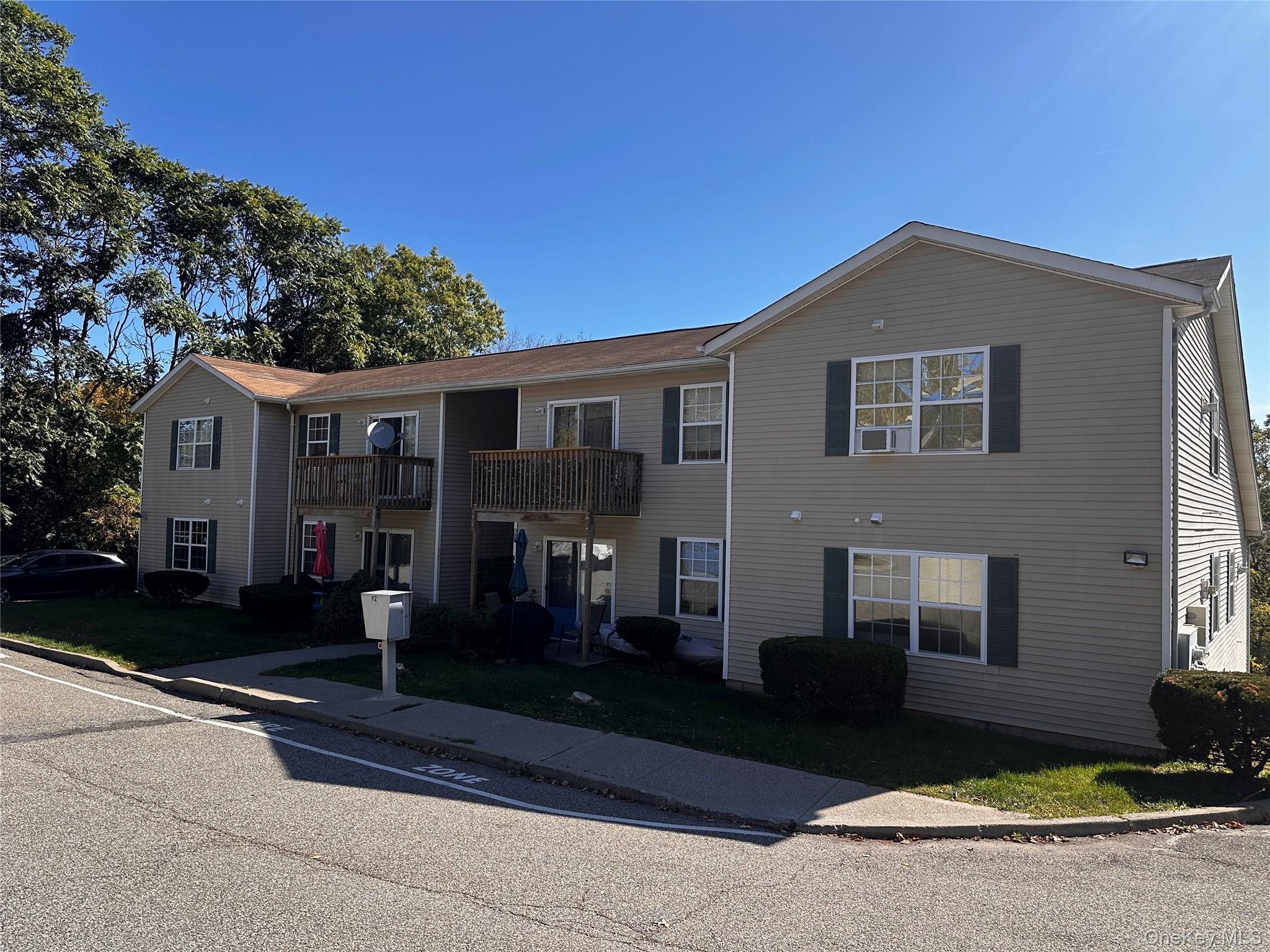 a front view of a house with yard