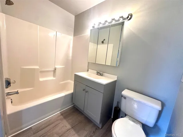 a bathroom with a toilet sink and a bathtub