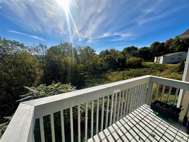 a bedroom with a bed and a night stand