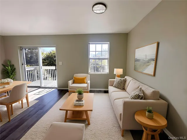 a view of a kitchen with wooden floor and a kitchen