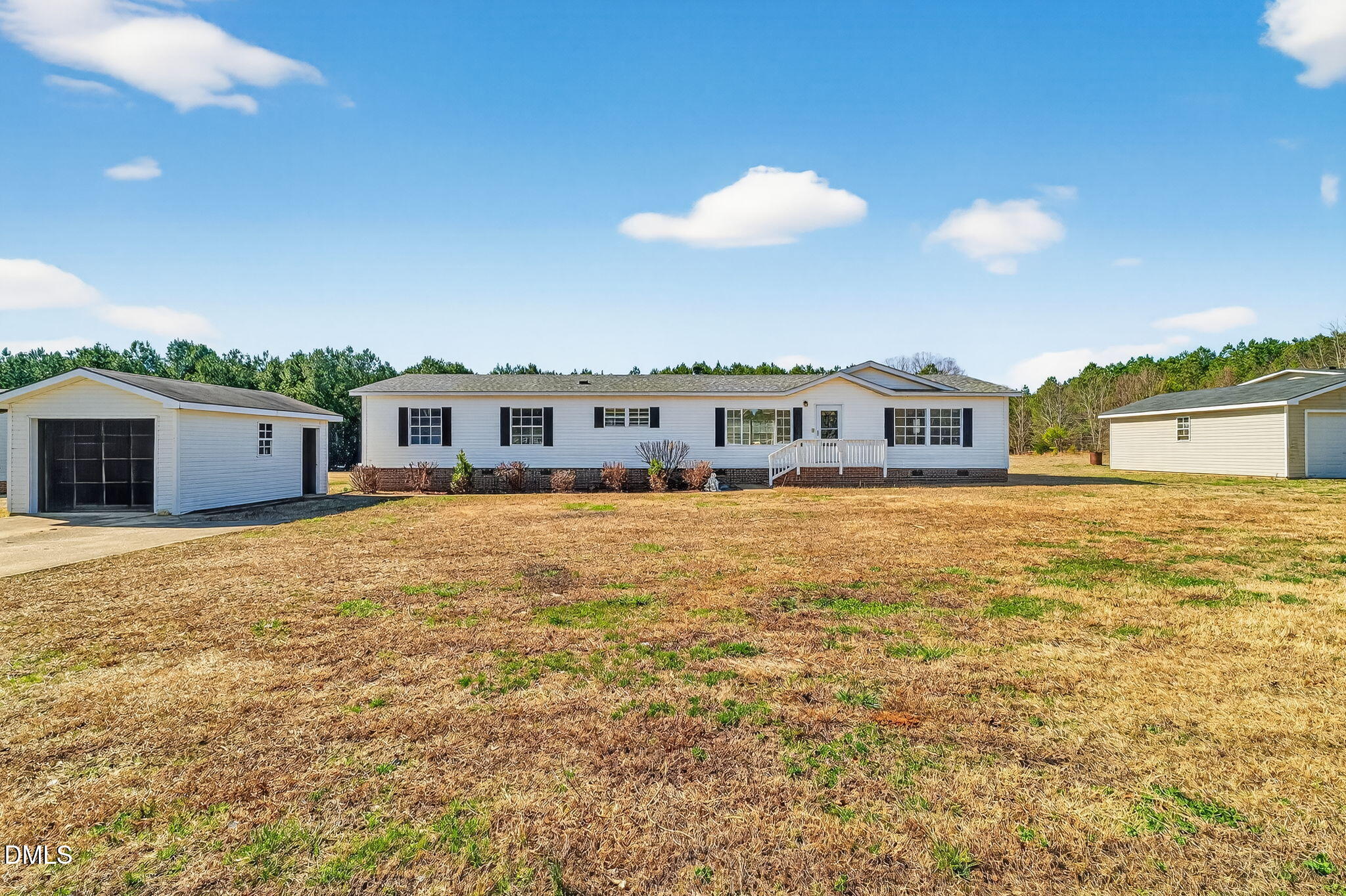 10015 Smith Road Middlesex, NC 27557 - Photo 4 of 48 a view of a house with a backyard
