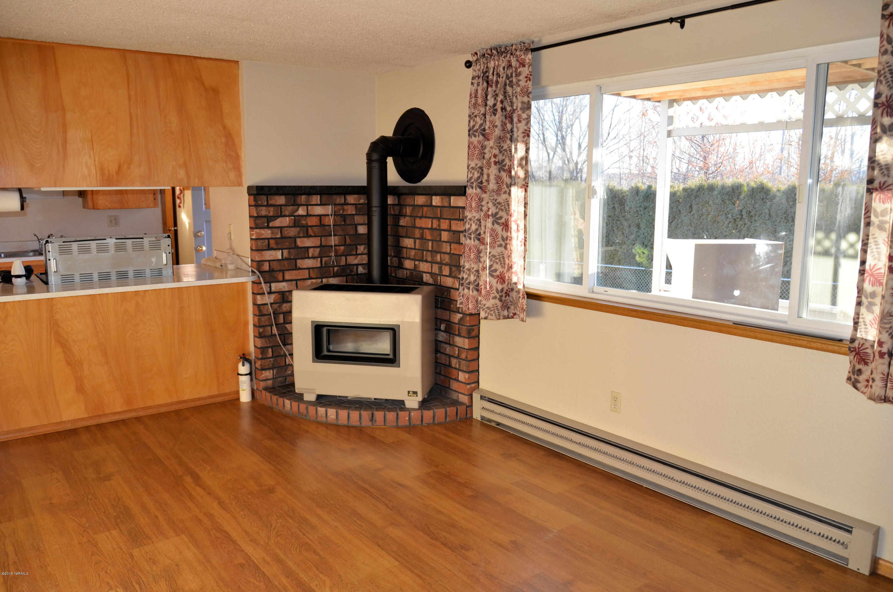 10814 Summitview Road Yakima, WA 98908 - Photo 7 of 16 wooden floor in an empty room with a window