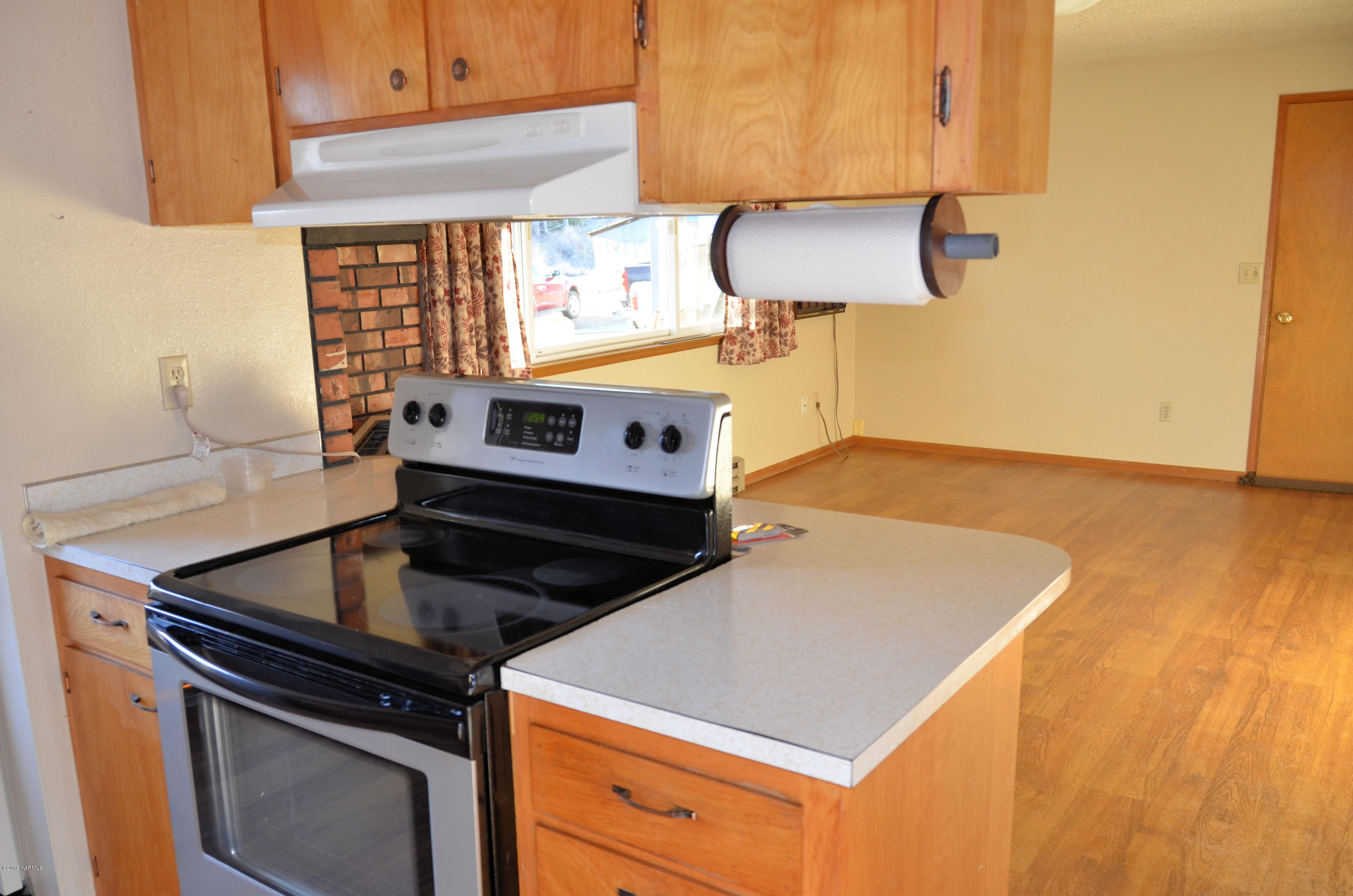 10814 Summitview Road Yakima, WA 98908 - Photo 8 of 16 a kitchen with stainless steel appliances granite countertop a stove a sink and a microwave
