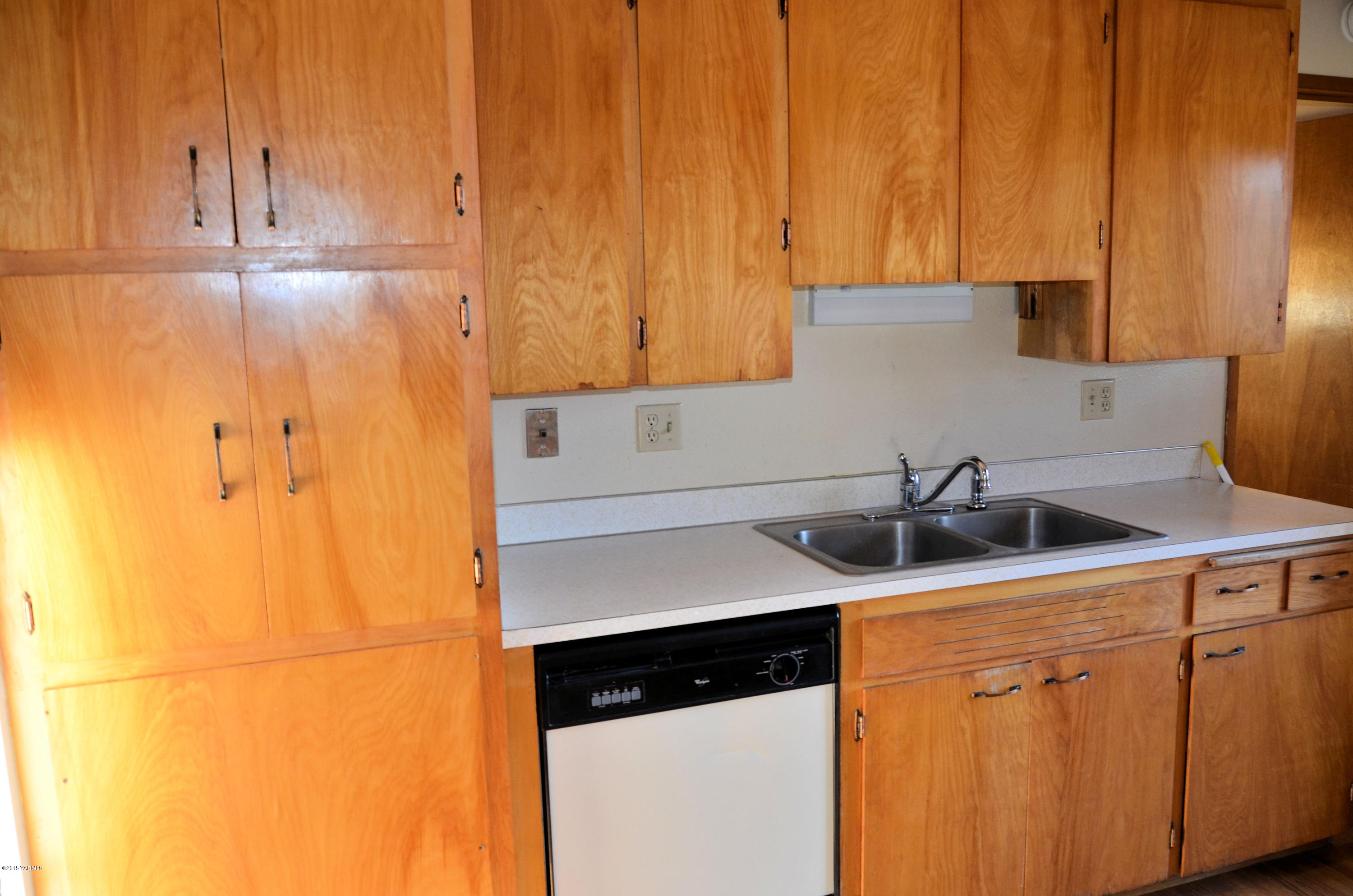 10814 Summitview Road Yakima, WA 98908 - Photo 9 of 16 a kitchen with a sink and cabinets