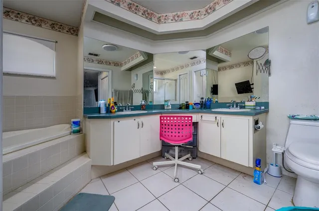 a room with furniture a mirror and a sink