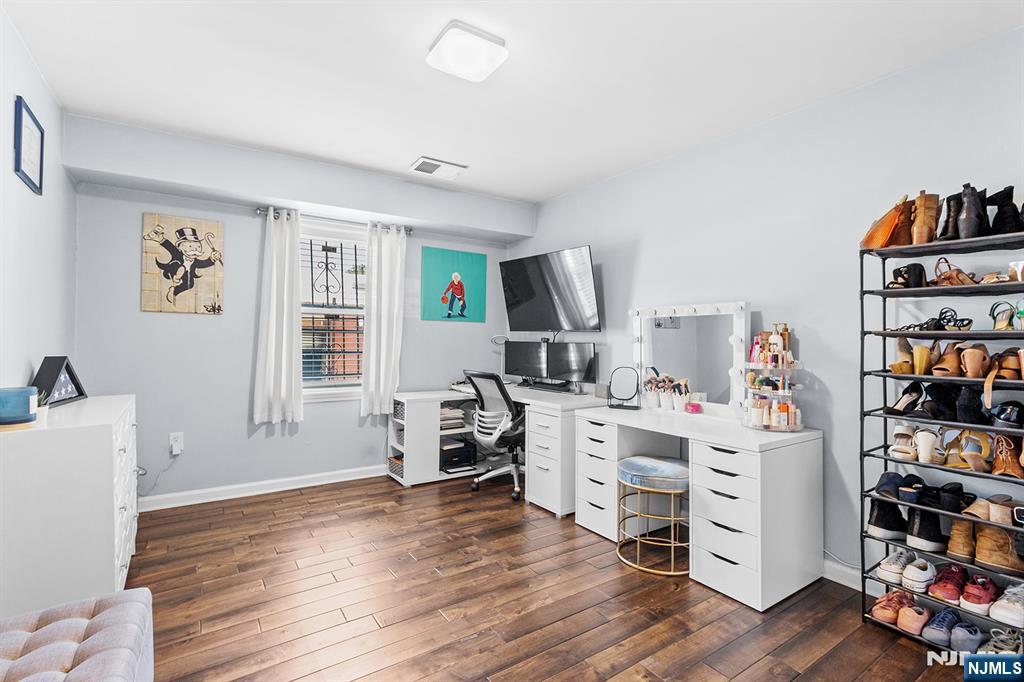 63-69 Rome Street, Unit 5K Newark, NJ 07105 - Photo 7 of 11 a view of a workspace with furniture and bedroom
