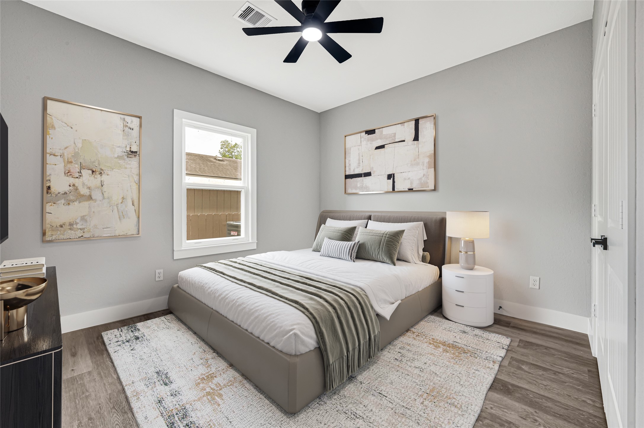 5930 Boness Road, Unit A & B Houston, TX 77396 - Photo 32 of 43 Experience comfort and style in this beautifully staged bedroom, featuring elegant decor, natural light, and a cozy atmosphere perfect for relaxation.