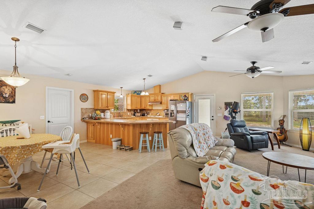 8240 Tidwell Road Pace, FL 32571 - Photo 12 of 41 a living room with furniture and a large window