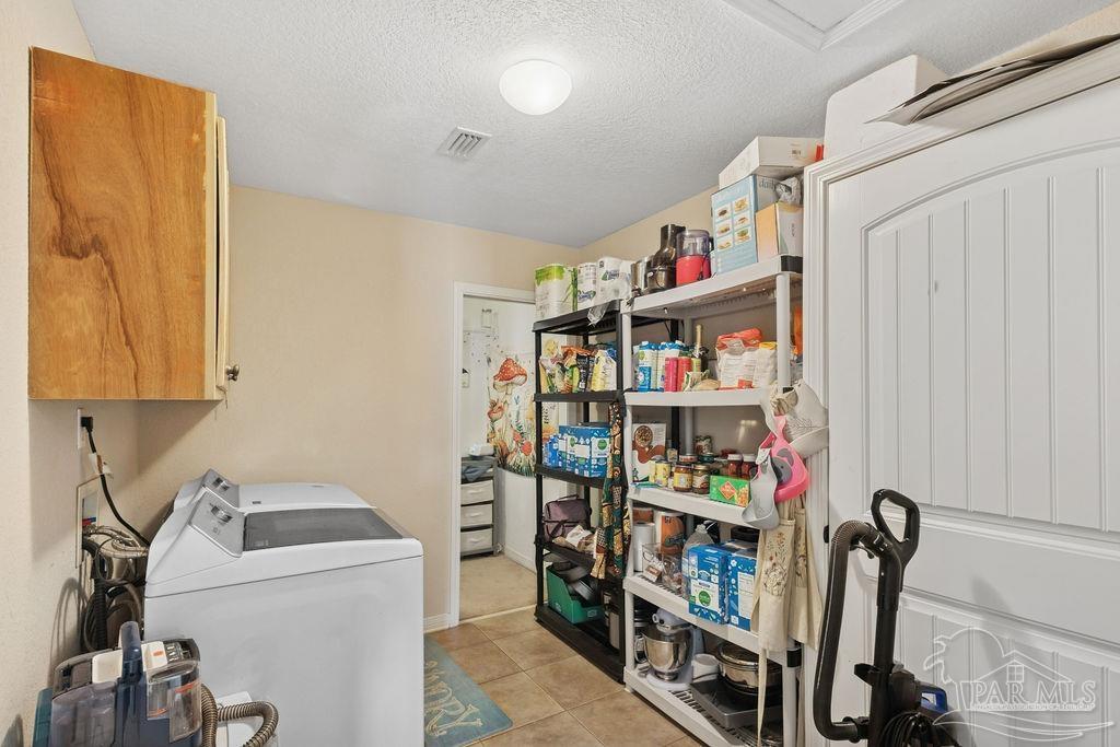 8240 Tidwell Road Pace, FL 32571 - Photo 18 of 41 a room with storage and utility