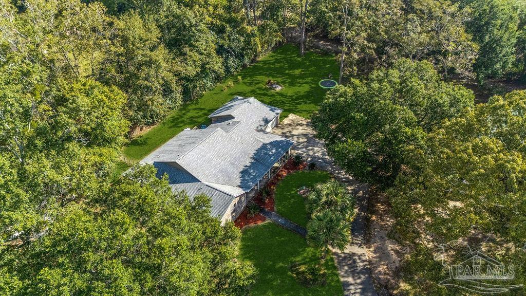 8240 Tidwell Road Pace, FL 32571 - Photo 30 of 41 a view of a tree in a yard