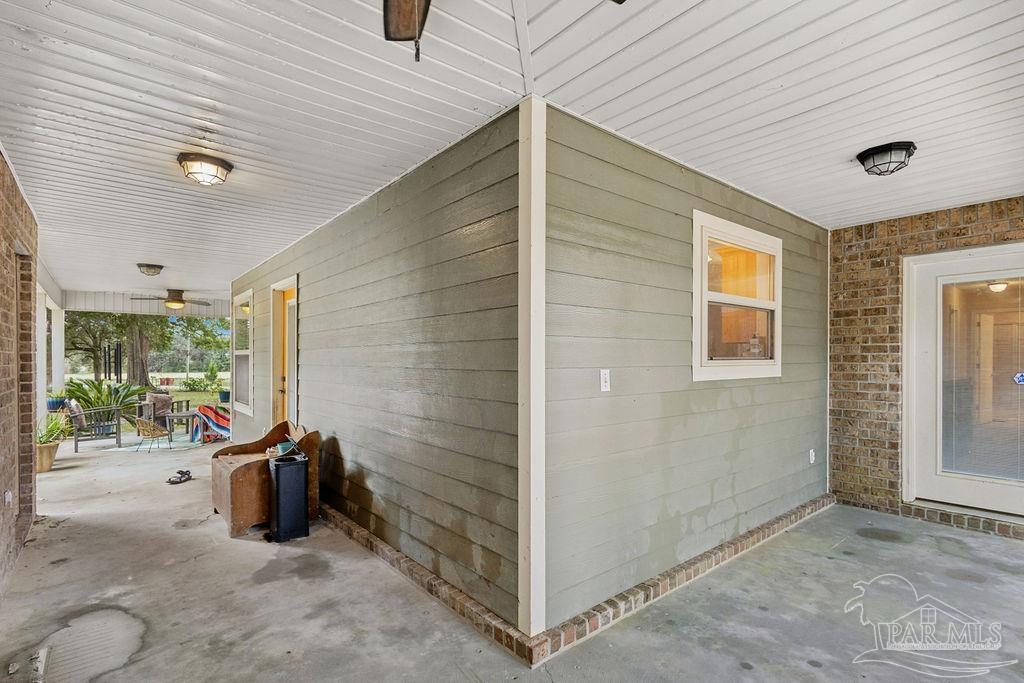 8240 Tidwell Road Pace, FL 32571 - Photo 33 of 41 a view of a livingroom with storage space