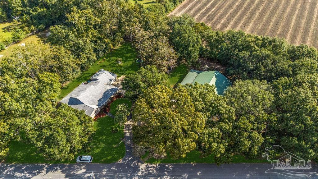 8240 Tidwell Road Pace, FL 32571 - Photo 36 of 41 an aerial view of a house with yard
