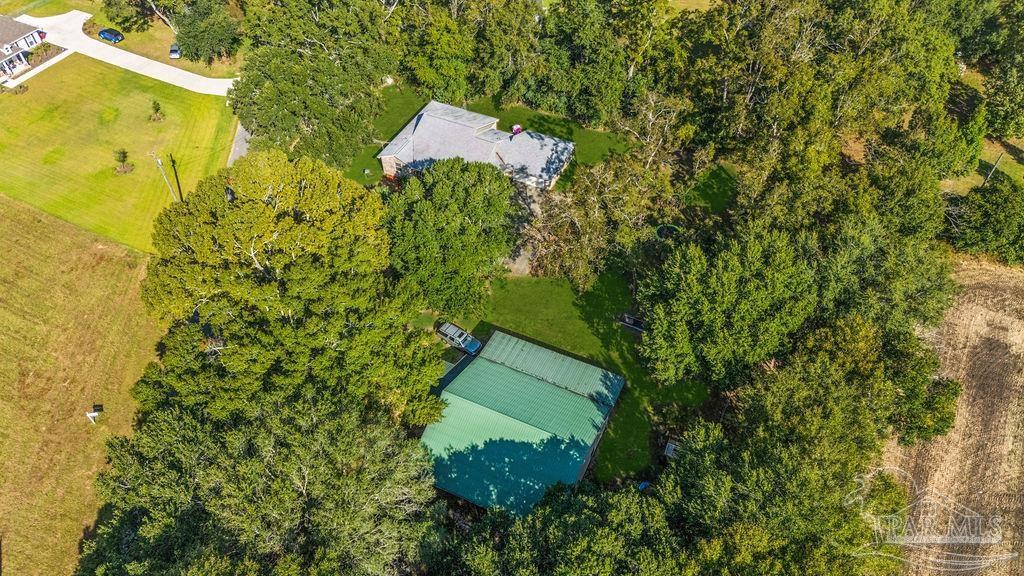 8240 Tidwell Road Pace, FL 32571 - Photo 37 of 41 a view of a garden