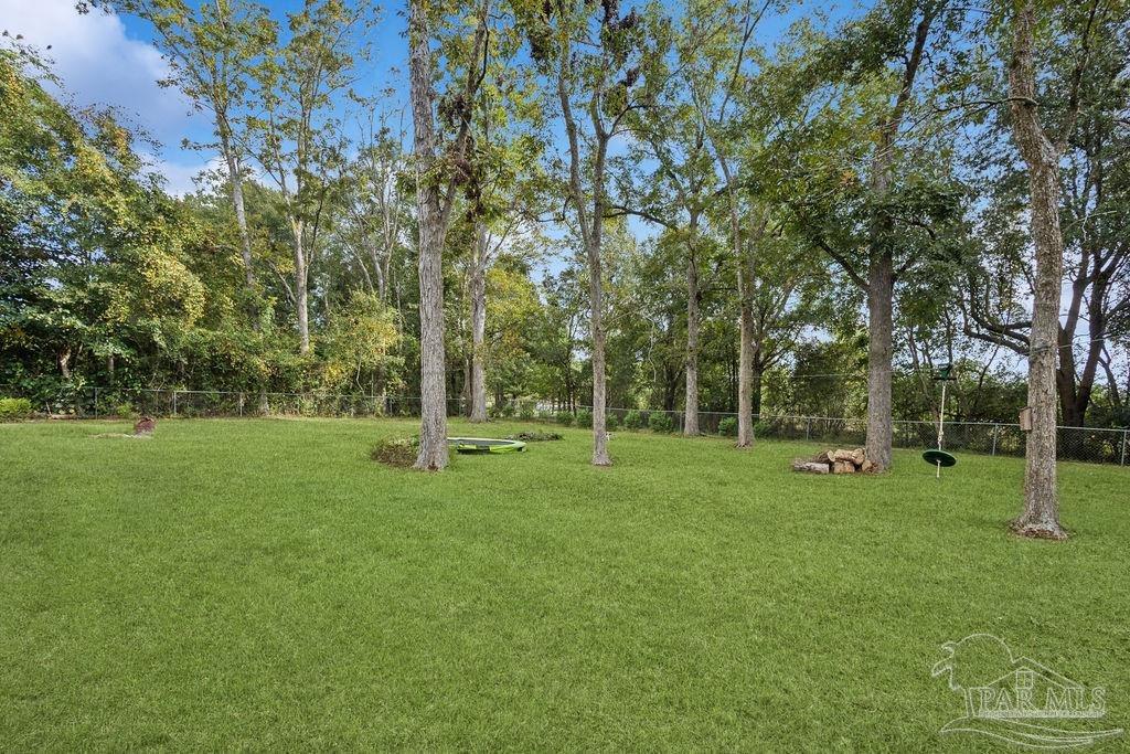 8240 Tidwell Road Pace, FL 32571 - Photo 5 of 41 a view of a park with large trees