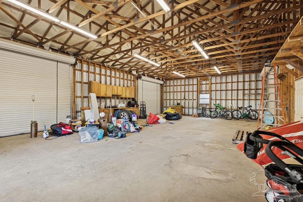 8240 Tidwell Road Pace, FL 32571 - Photo 7 of 41 a view of a room with gym equipment