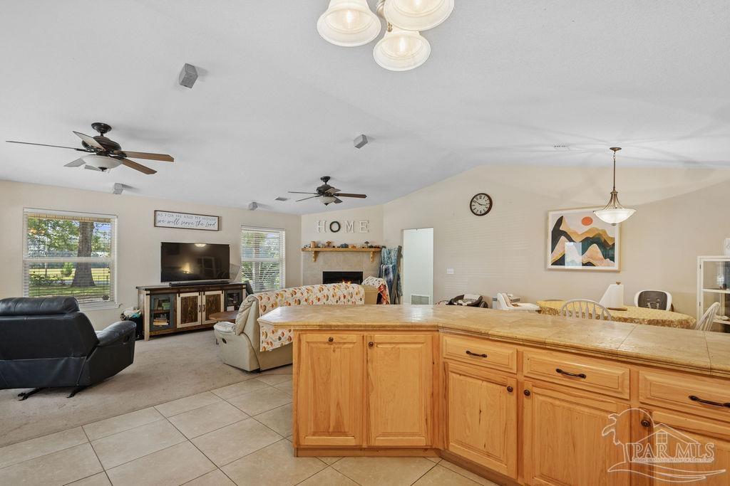 8240 Tidwell Road Pace, FL 32571 - Photo 10 of 41 a kitchen with cabinets and window