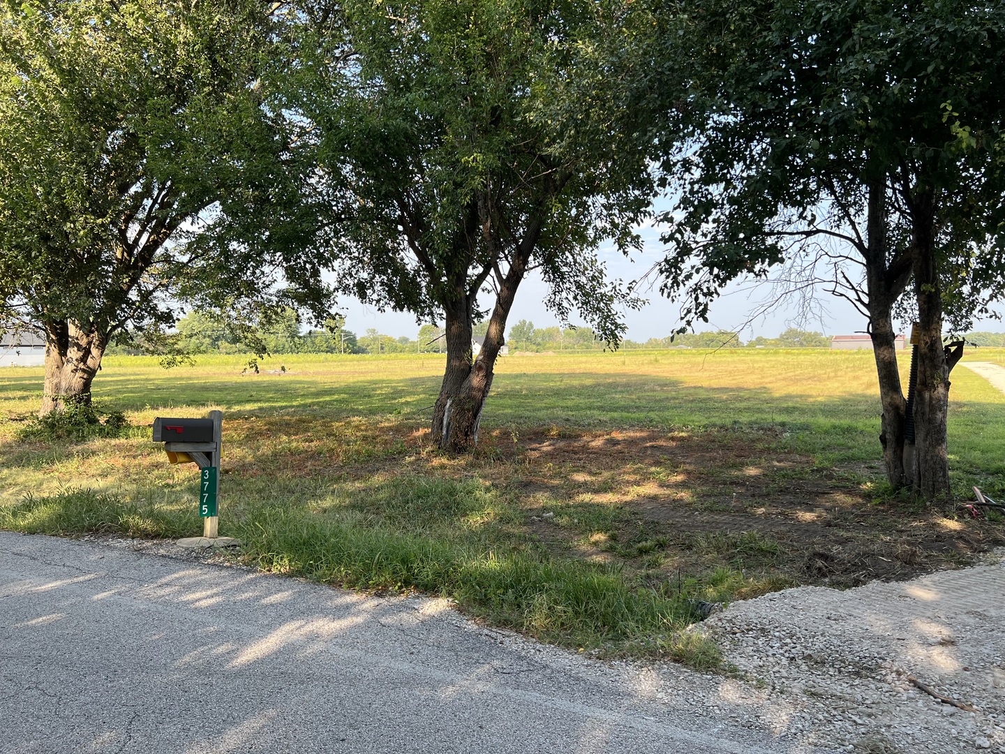 a view of a lake with a yard
