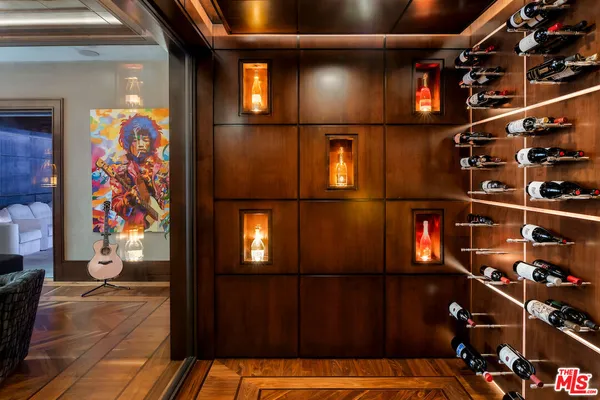 a spacious bedroom with a bed and large windows