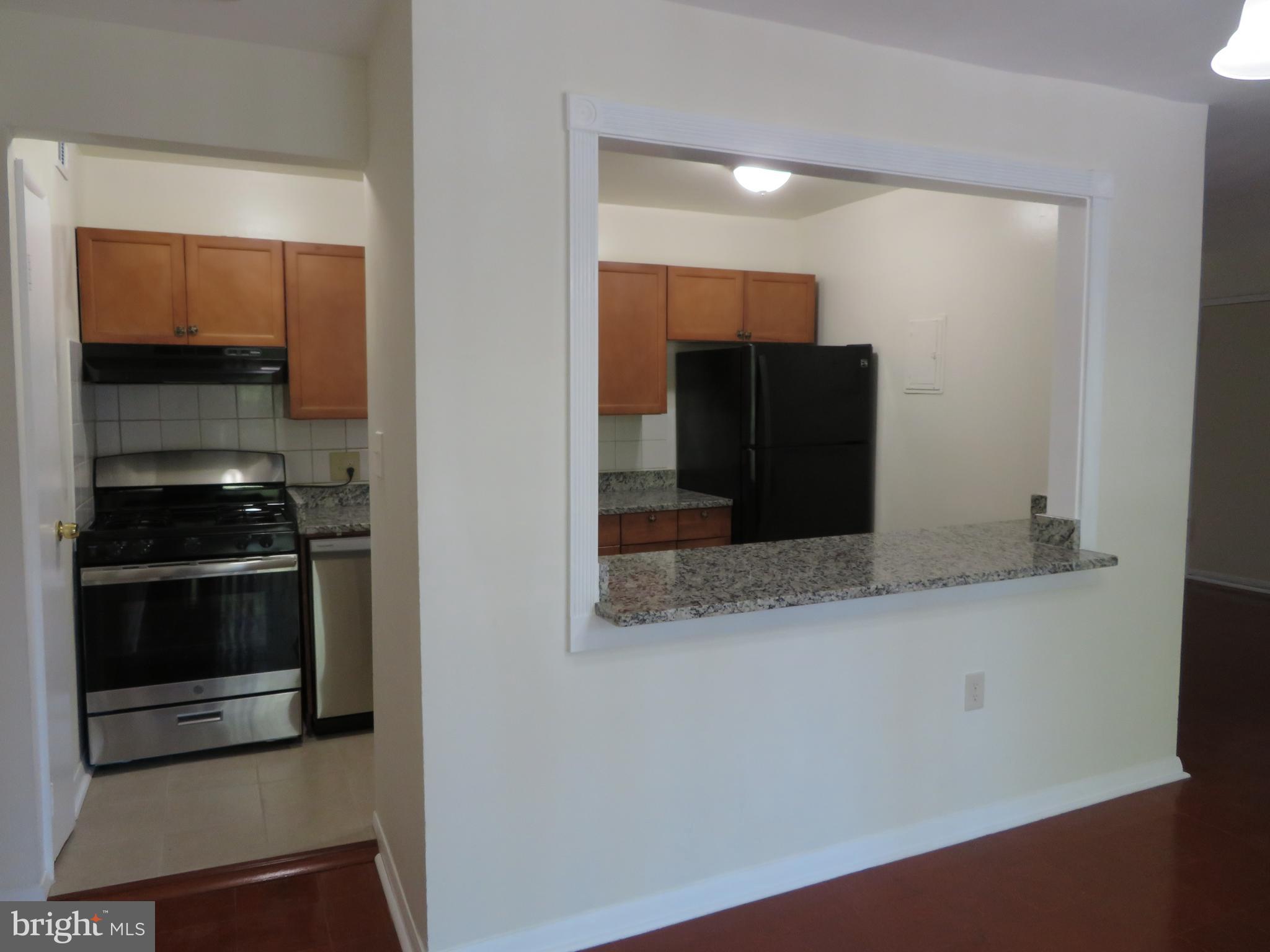 3742 Bel Pre Road, Unit 11 Silver Spring, MD 20906 - Photo 5 of 16 Renovated Kitchen with Stainless Steel Appliances