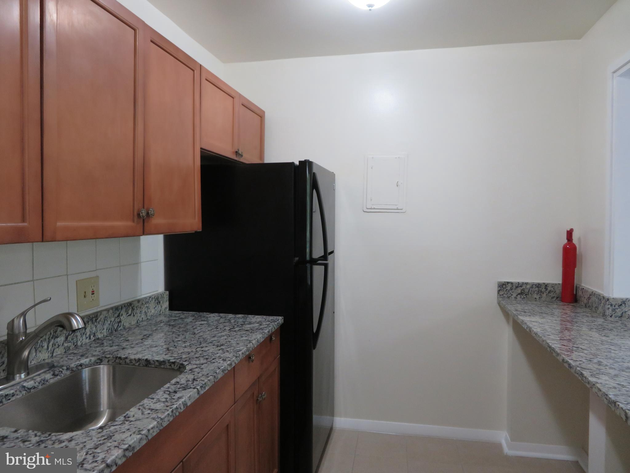 3742 Bel Pre Road, Unit 11 Silver Spring, MD 20906 - Photo 7 of 16 Renovated Kitchen with Granite Countertops
