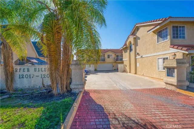 a view of small yard with palm trees