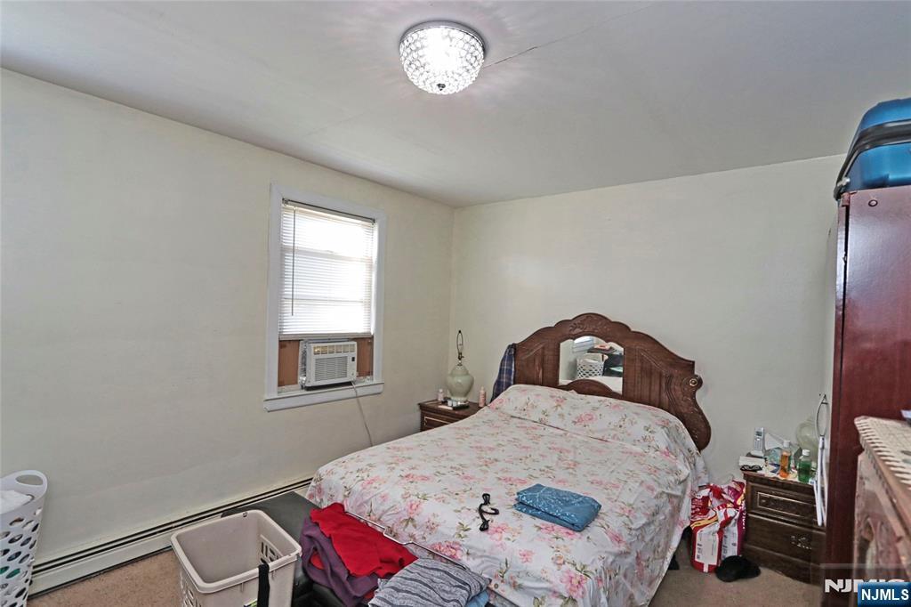 949 Front Plainfield, NJ 07062 - Photo 15 of 15 a bedroom with a bed and a window