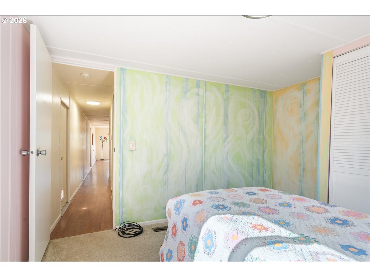 1418 Pine Street, Unit 7 Silverton, OR 97381 - Photo 16 of 27 a bedroom with a bed and a shower