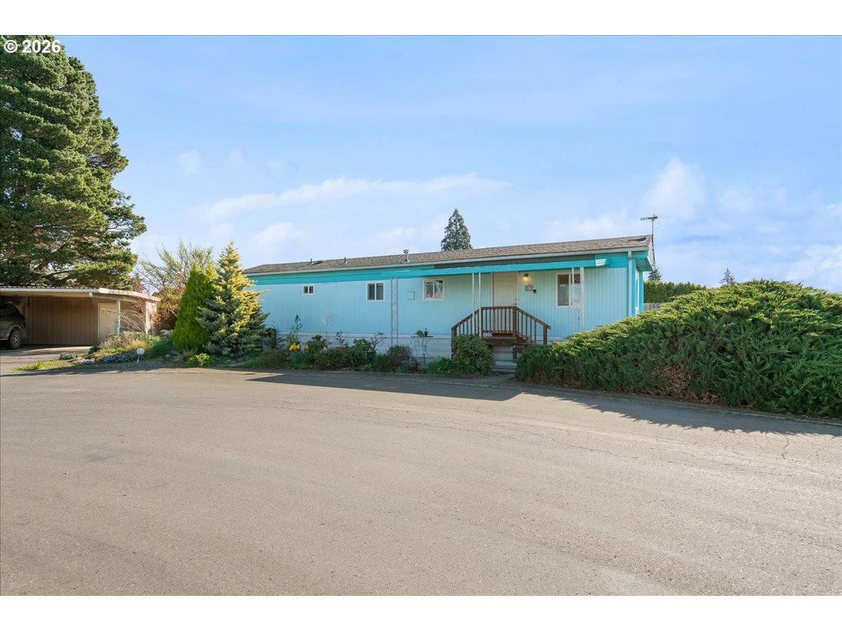 1418 Pine Street, Unit 7 Silverton, OR 97381 - Photo 2 of 27 a view of a street with a building in the background