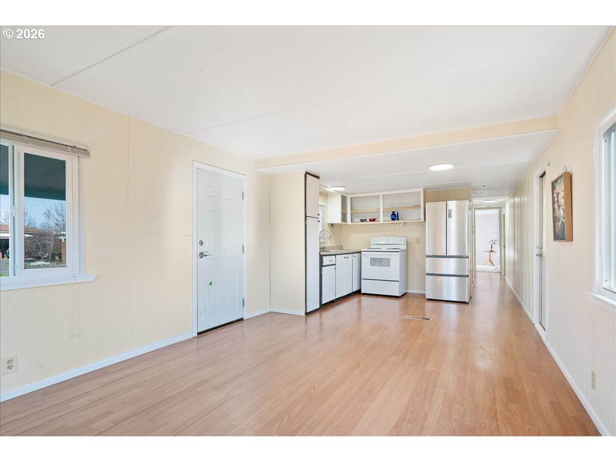 1418 Pine Street, Unit 7 Silverton, OR 97381 - Photo 8 of 27 a view of a kitchen with wooden floor and a kitchen