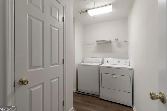 a utility room with dryer and washer