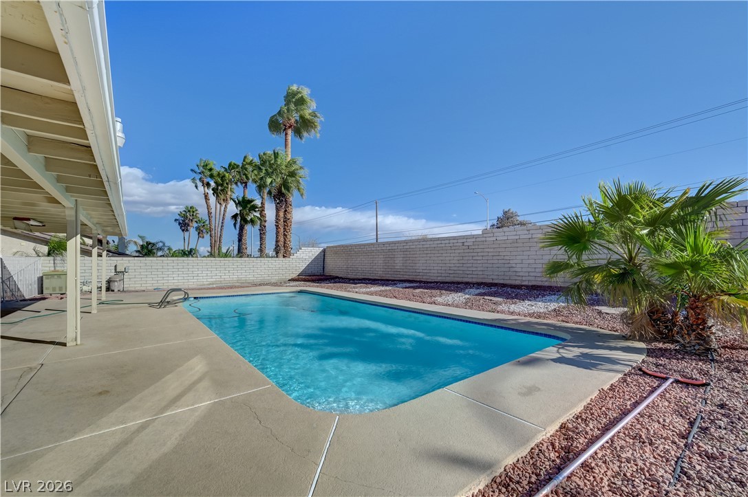 6635 Costa Brava Road Las Vegas, NV 89146 - Photo 56 of 59 Relax poolside in a private outdoor oasis with ample patio space for leisure and entertaining.