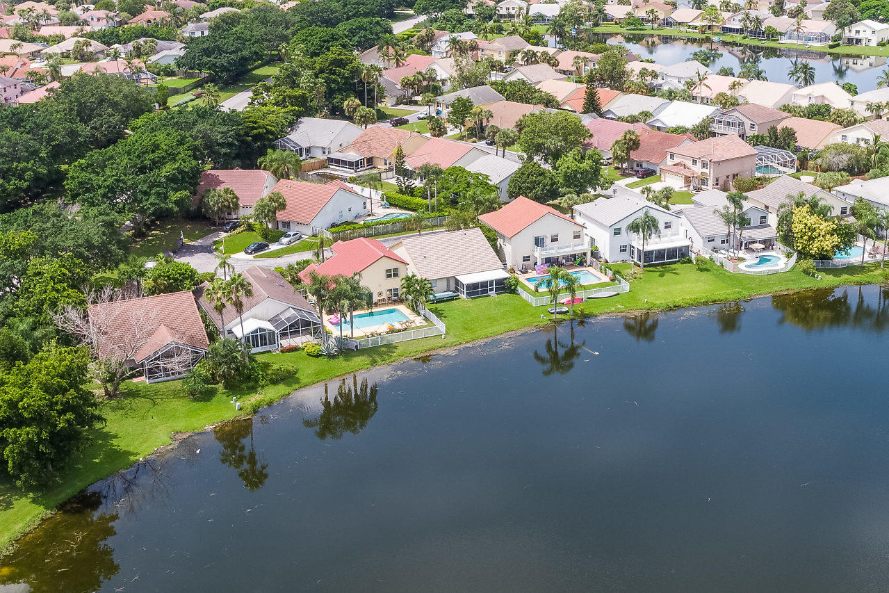 7283 Shell Ridge Terrace Lake Worth, FL 33467 - Photo 27 of 32 an aerial view of a house with a lake view