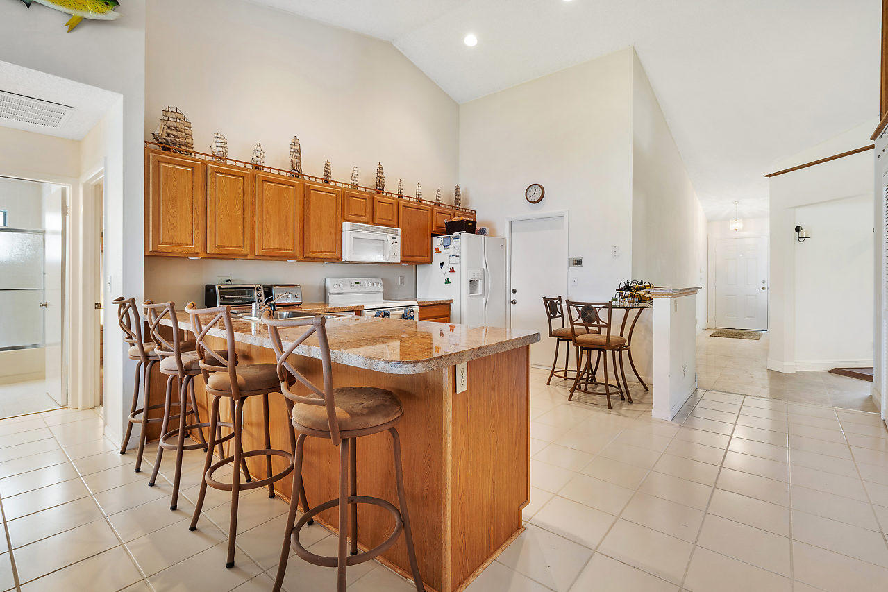 7283 Shell Ridge Terrace Lake Worth, FL 33467 - Photo 8 of 32 a view of a dining room with furniture