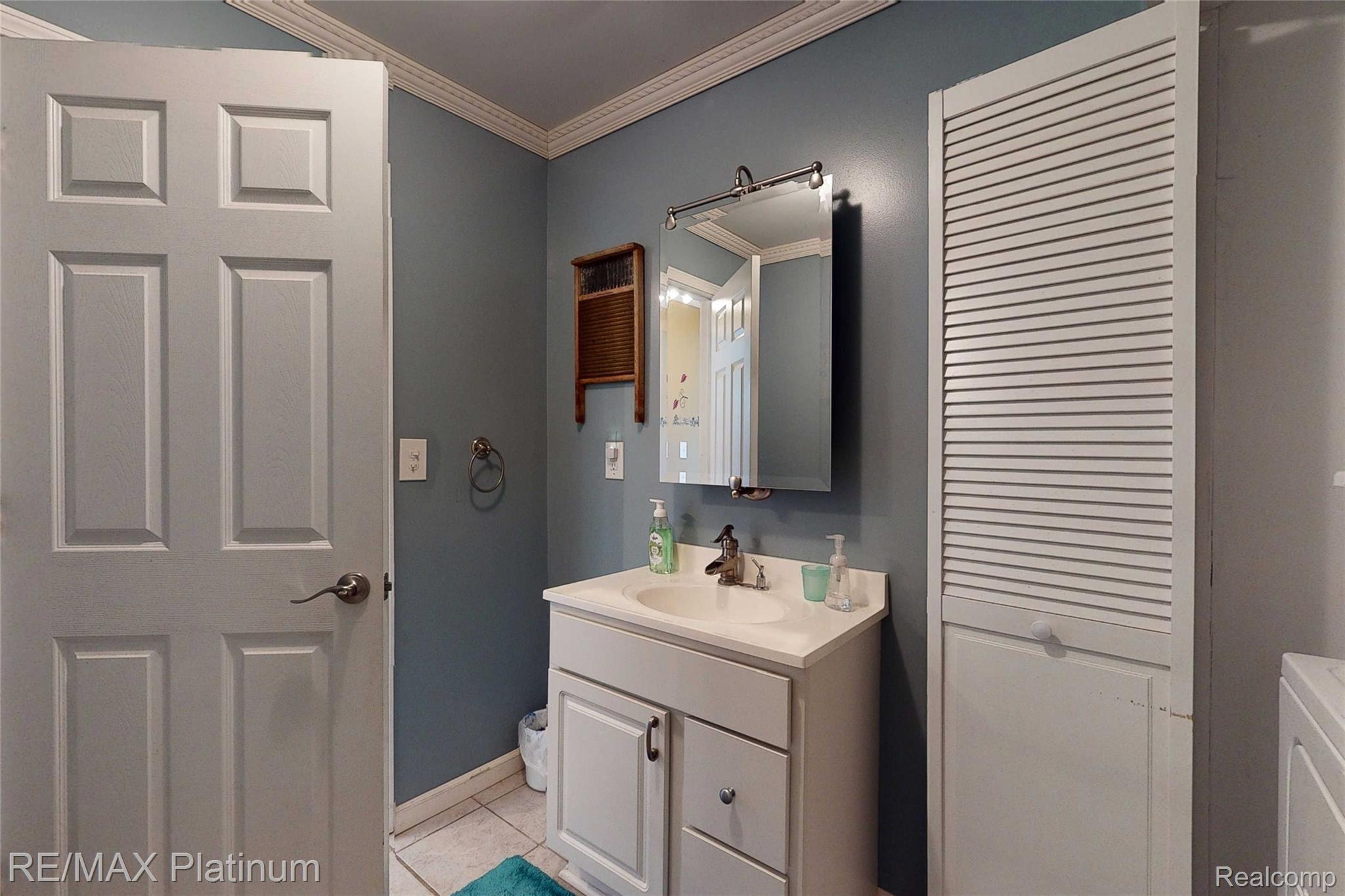 857 East Olson Road Midland, MI 48640 - Photo 32 of 52 857-E-Olson-Rd-25 Bathroom Laundry.jpg